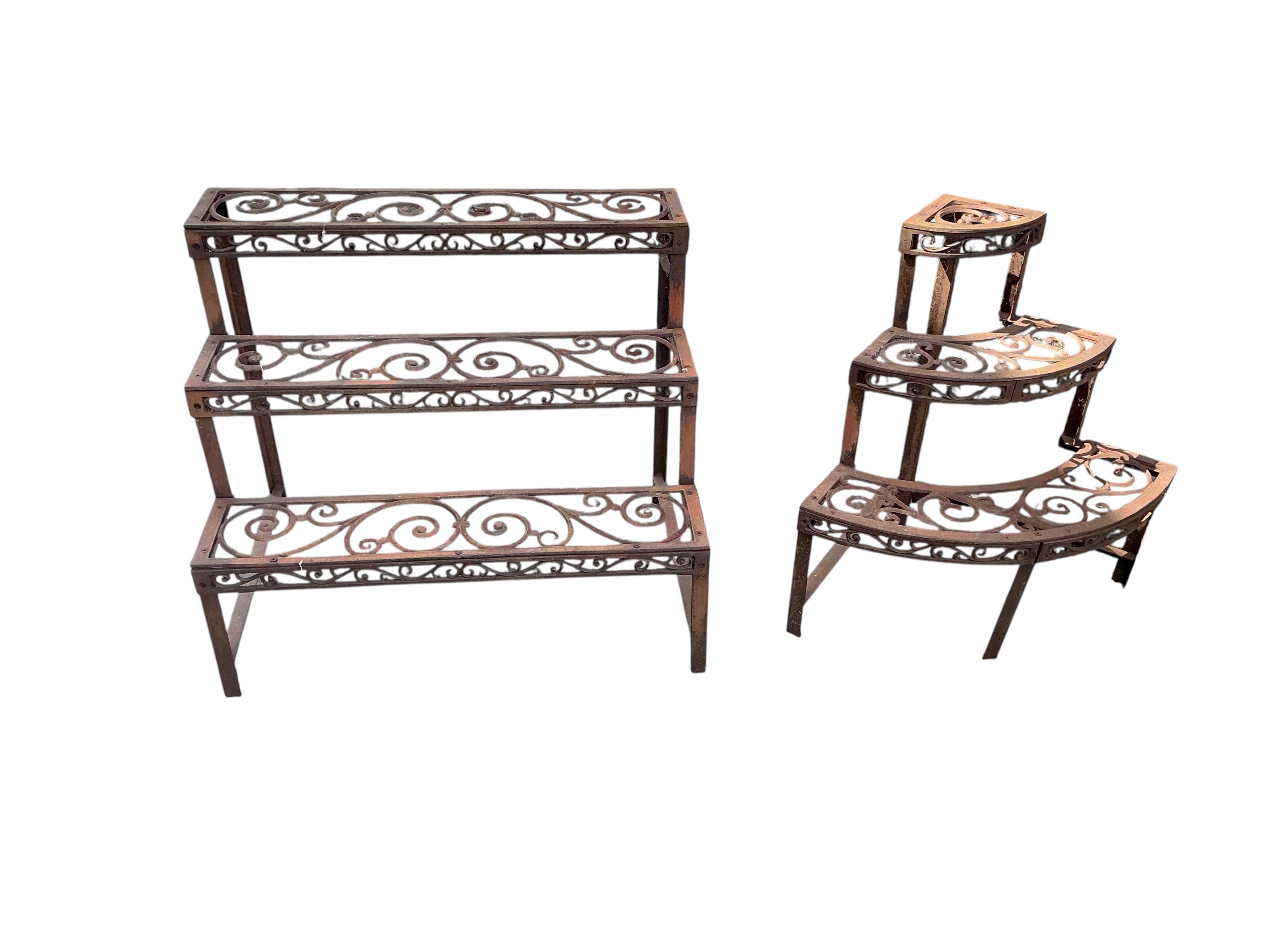 Two Victorian style cast metal pot stands, larger width 76cm, height 65cm